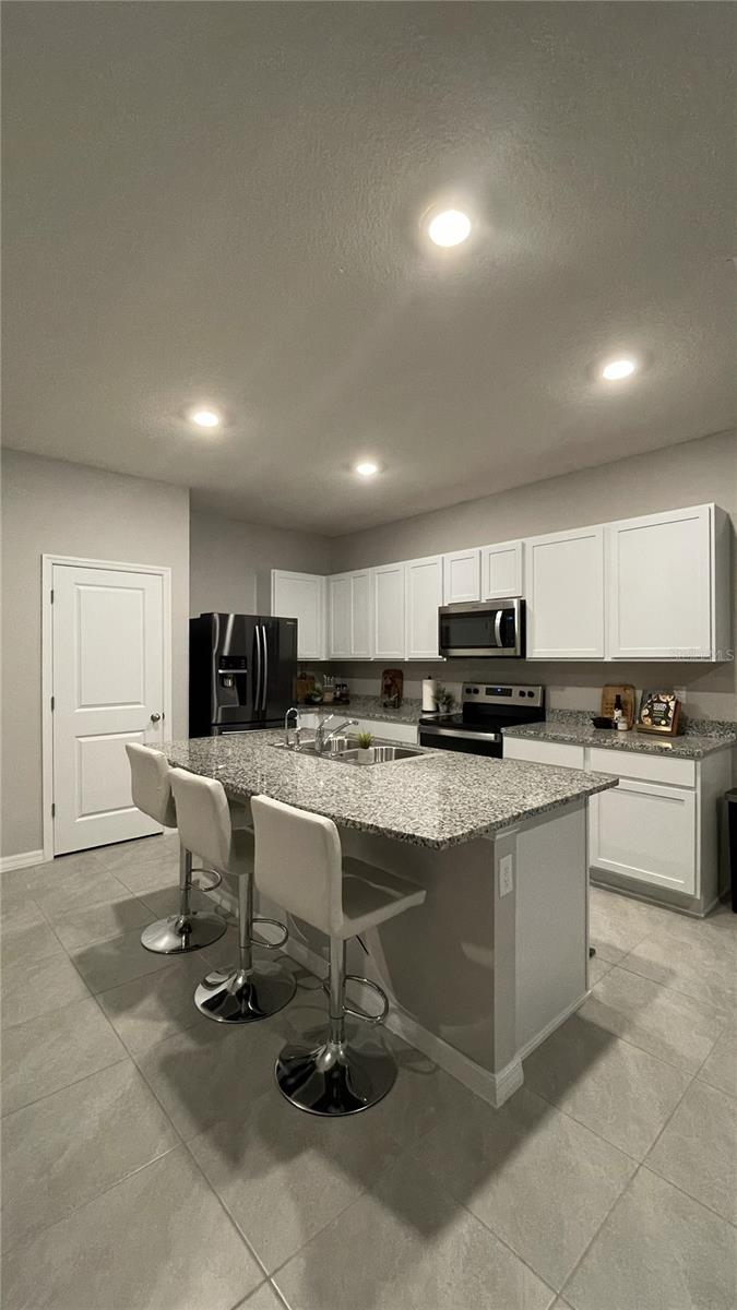 Kitchen island with 3 seater breakfast bar