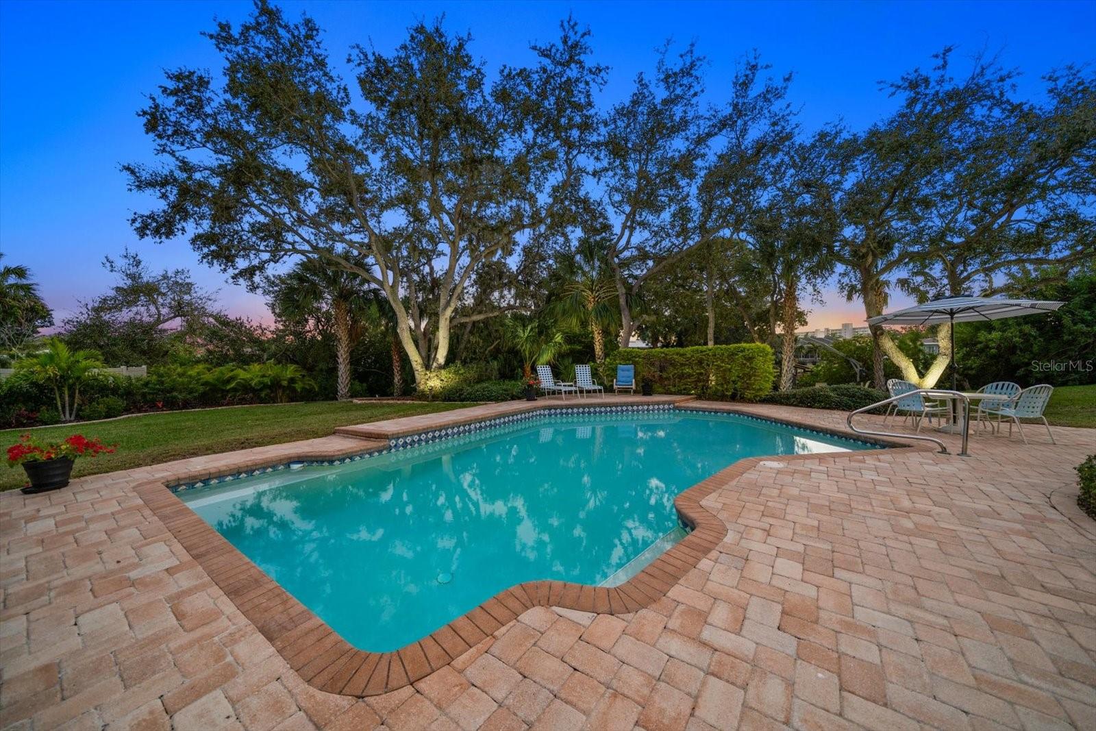 Outdoor living features a resort-style pool and expansive green space!