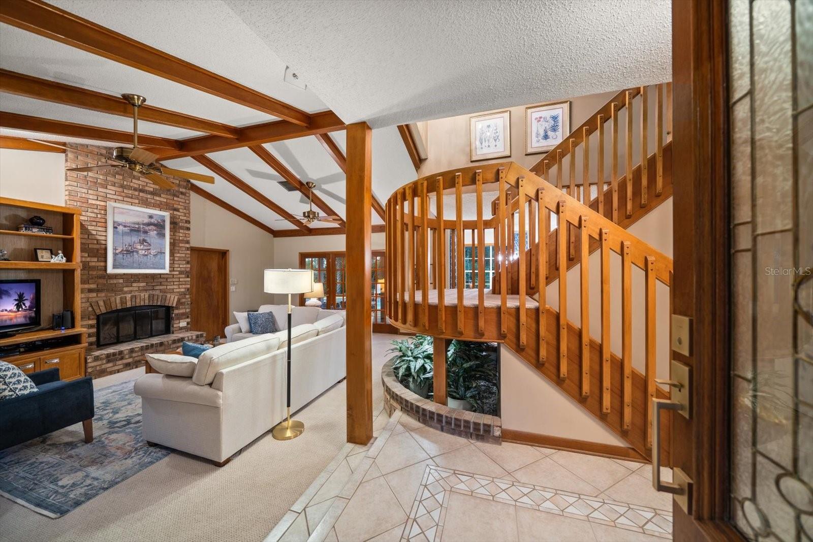 Family room with fireplace invites you to relax and enjoy living here!