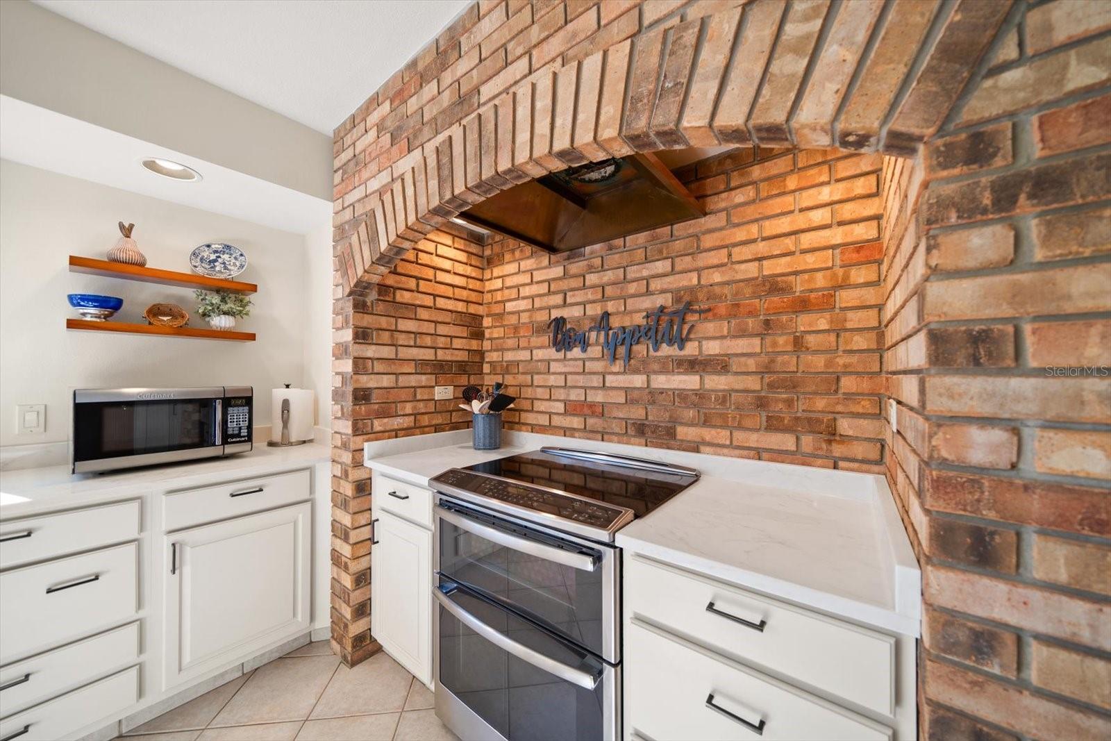 Brick wall feature adds interest to this impressive area.