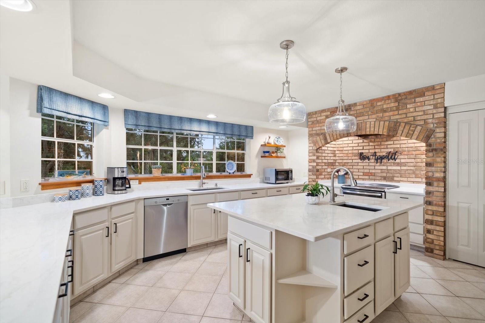 Center island workspace complements the abundant counter area.