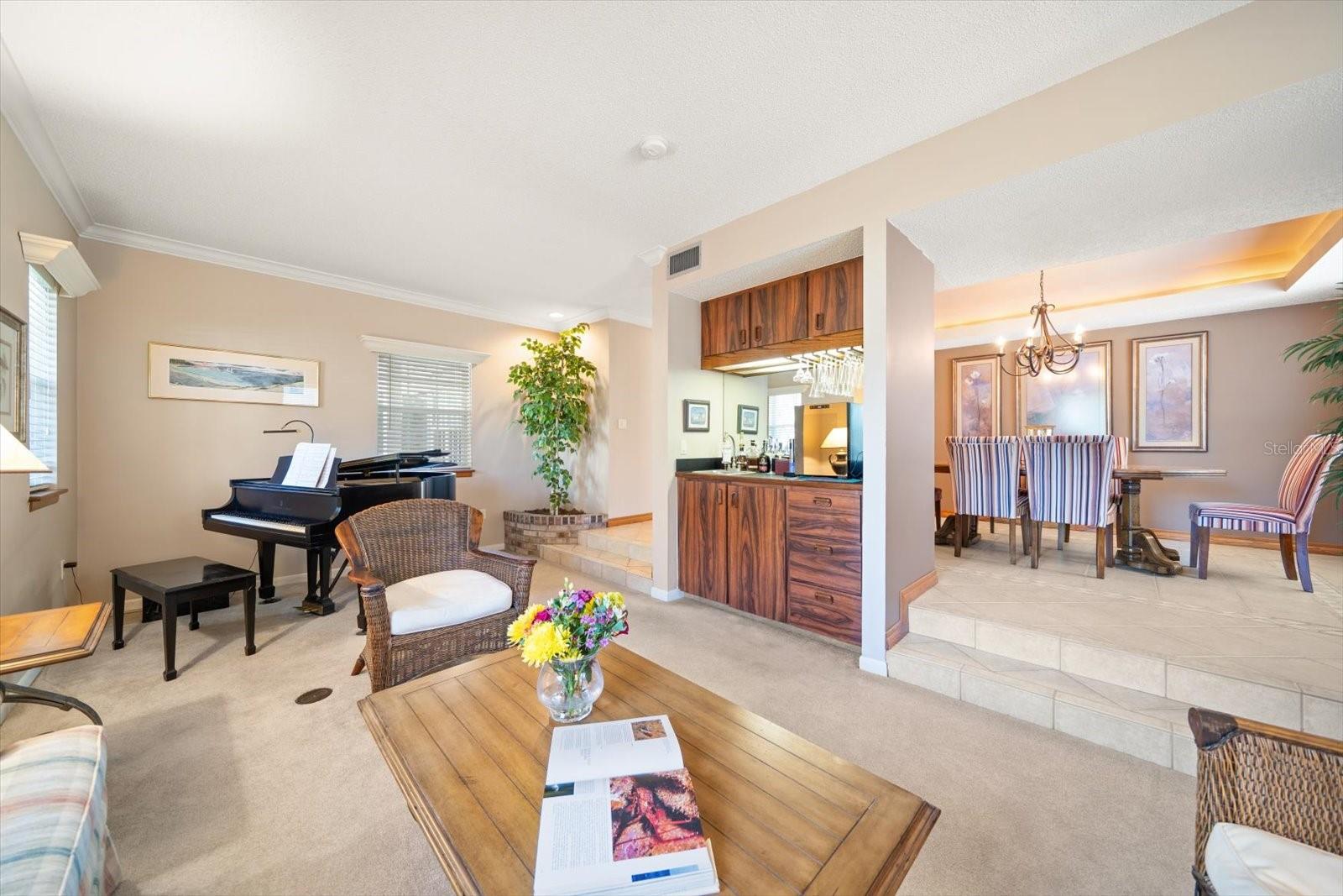 Living room area with wet bar.