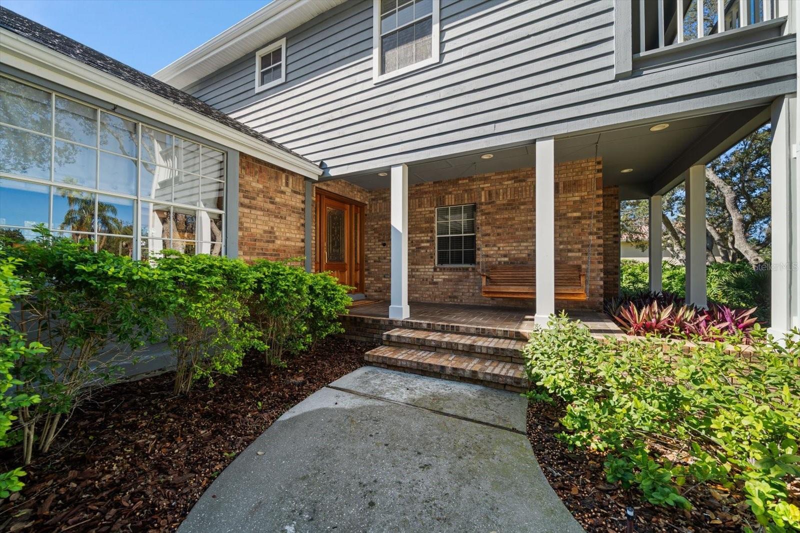Private entry with covered porch.