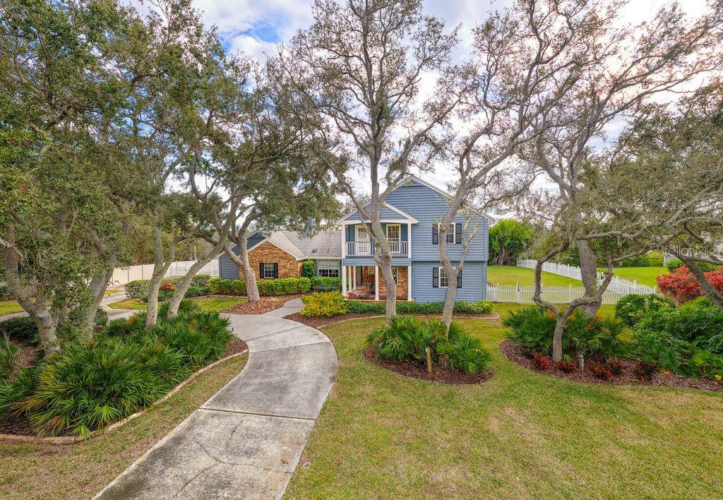 Approached by a long circular drive, this property is tucked away form busy roads yet minutes to shops, restaurants, schools, and beaches