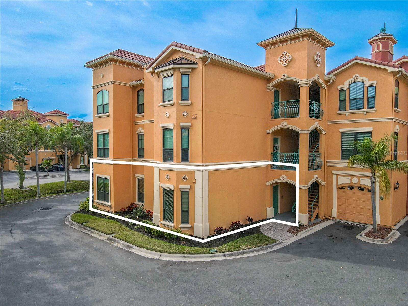 2 bedroom 2 bath first-floor condo in Grand Bellagio at Baywatch, Mediterranean-inspired architecture and a desirable corner-style placement.