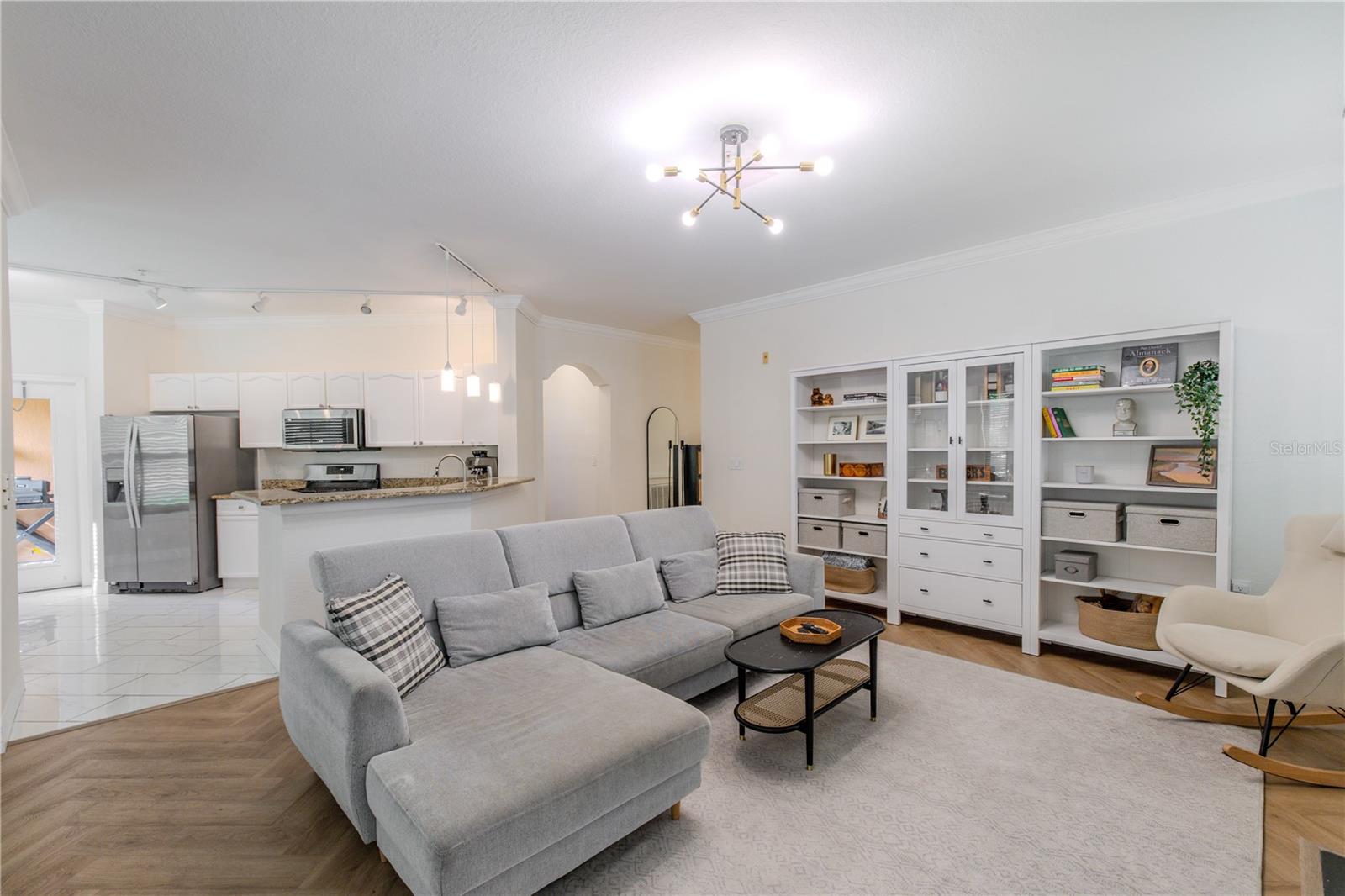 The living room and kitchen