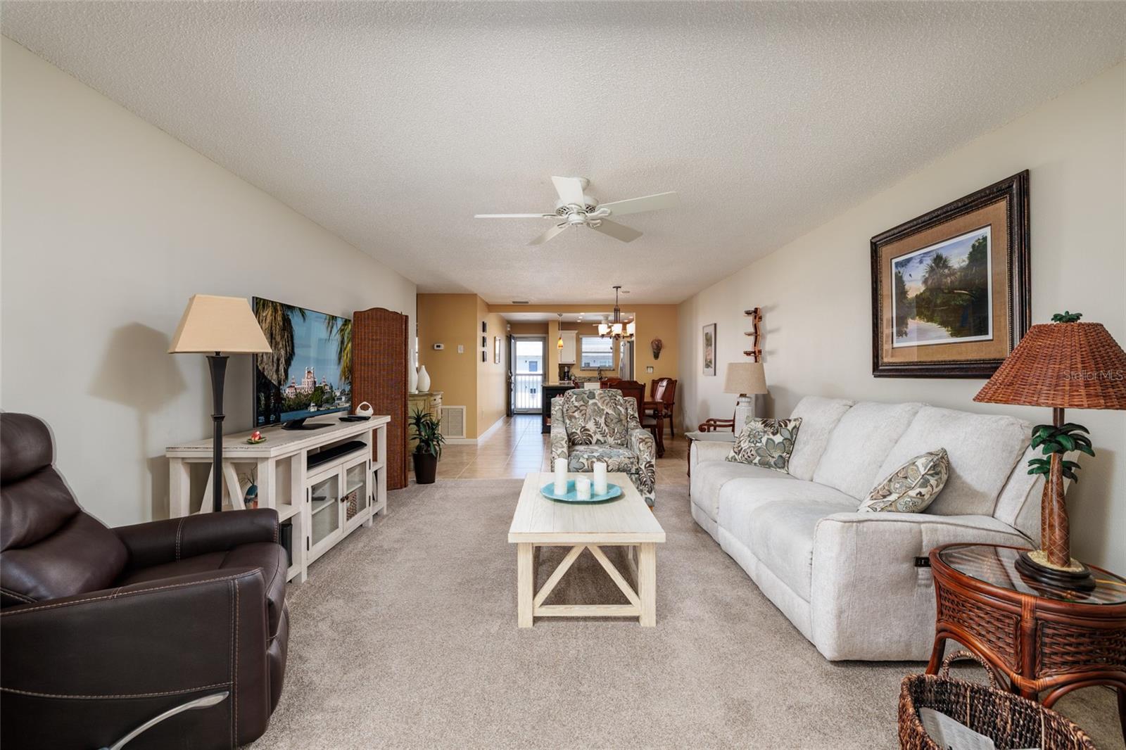 Living room & couch w/electric recliners.