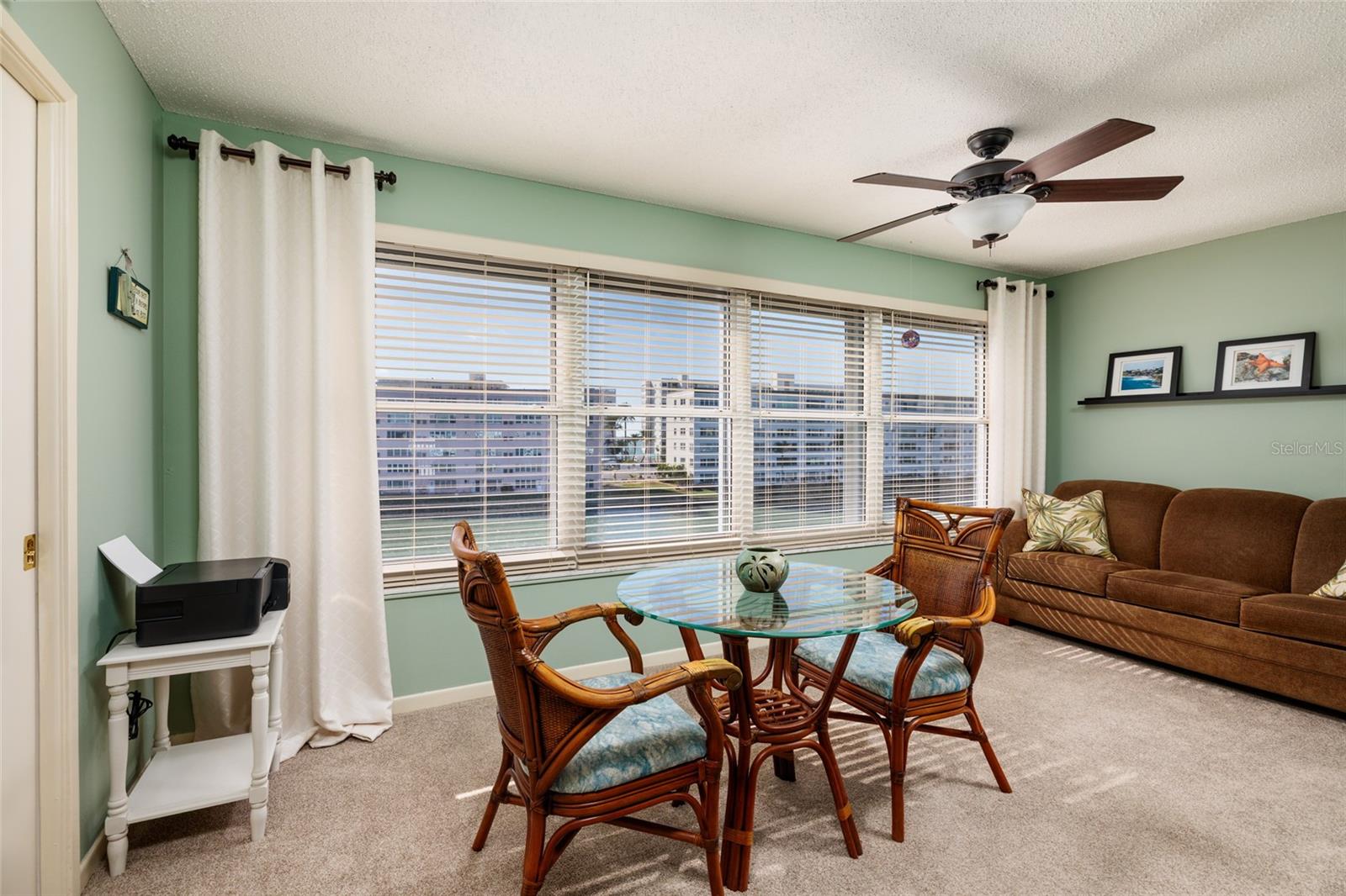 Florida room (8'x17'). Hurricane impact windows, storage closet, carpet & sleeper sofa..