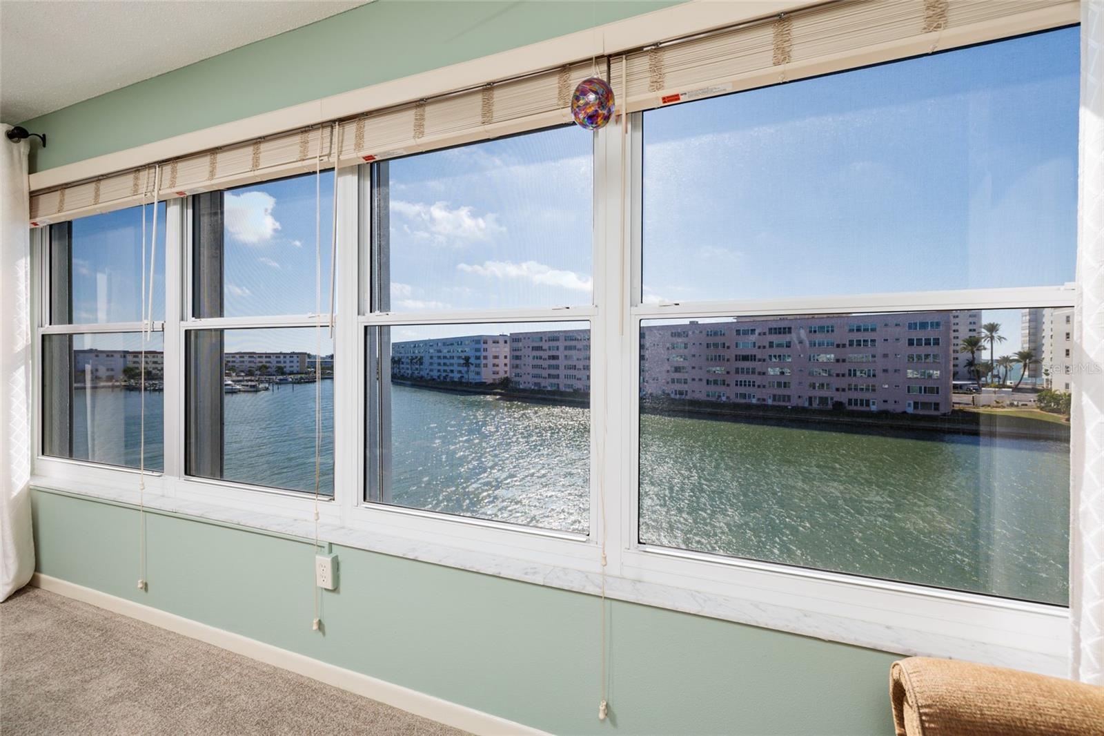 Florida room w/bay & marina views. Hurricane impact windows.