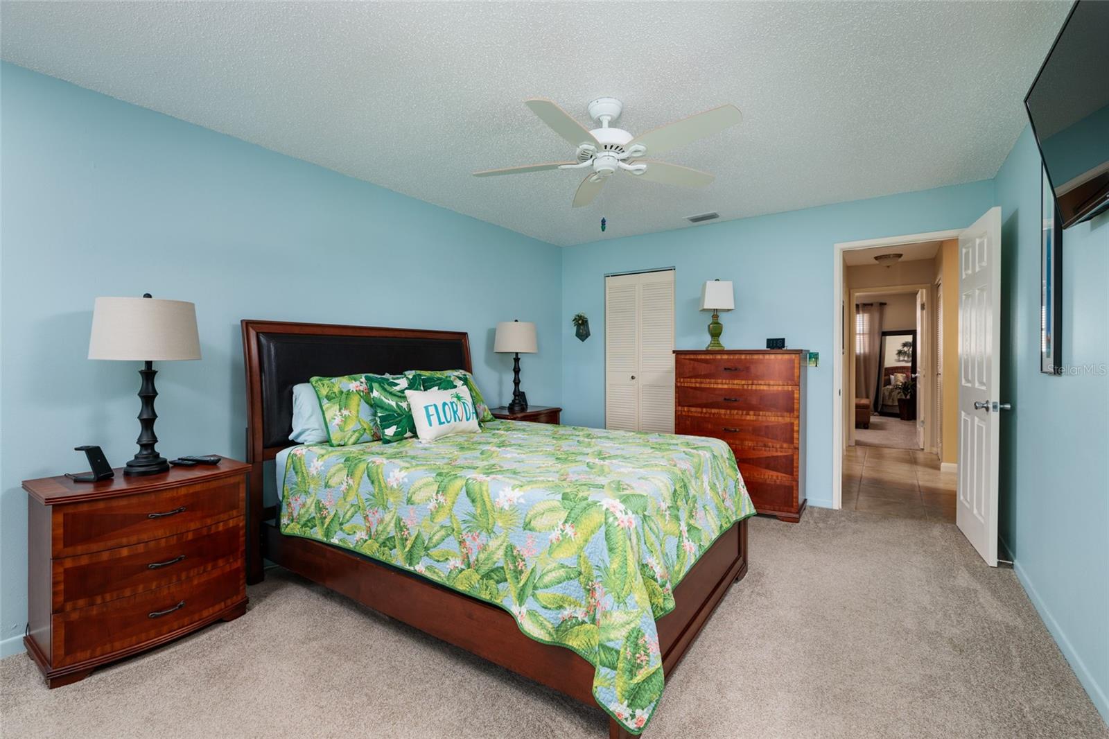 Primary bedroom w/Walk-in closet & door to hallway.