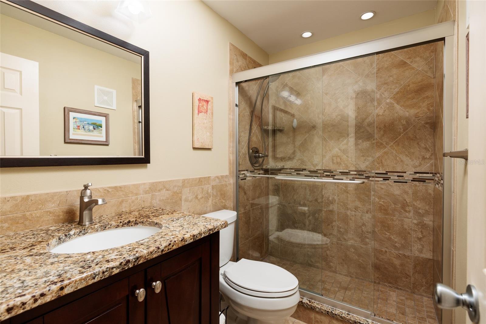 2nd bathroom (updated) w/Exhaust fan, GFCI outlet, shower, granite counter.