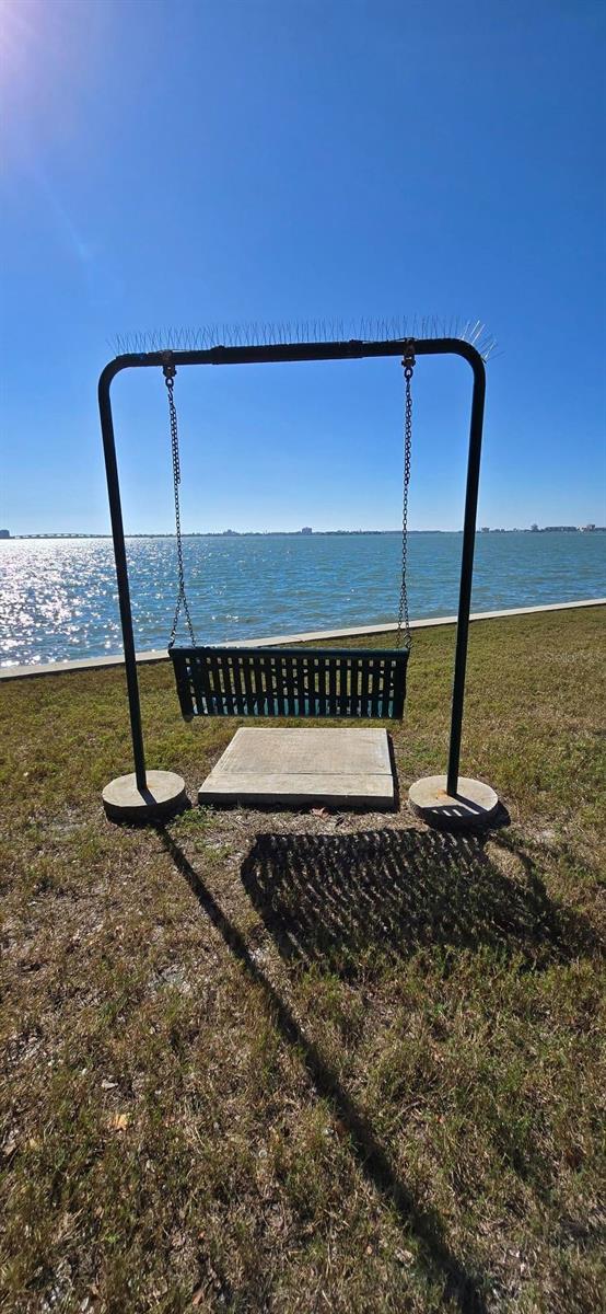 Town Shores chair swing at clubhouse on Boca Ciega Bay.