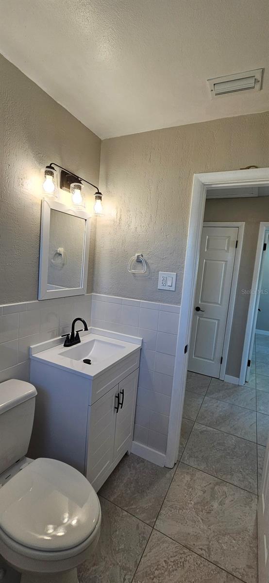 Full bathroom with tub/shower.