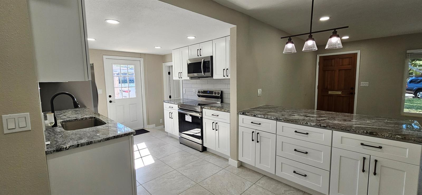 New cabinets, new appliances, new countertops, new sink, new flooring, etc