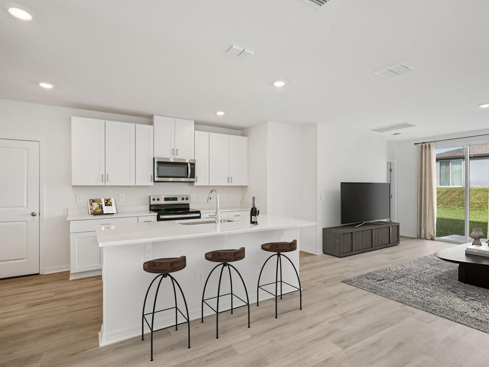 Interior photos are not of the actual home but are photos of the builder home with same floorplan with similar interior finishes and features. Photo uses virtual staging.