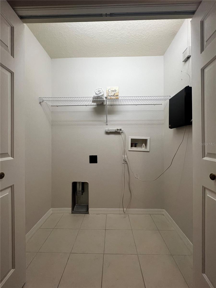 The laundry closet is spacious and conveniently upstairs with the bedrooms.