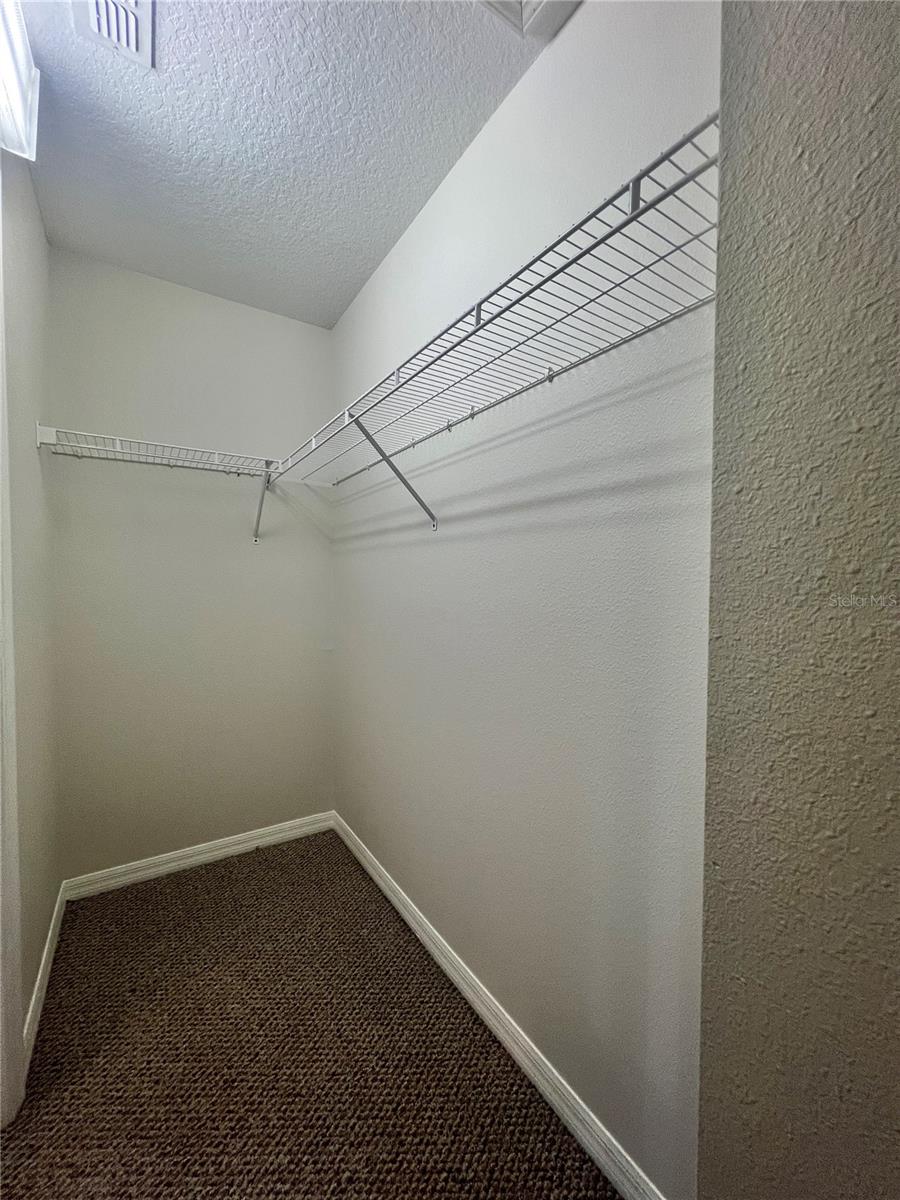 The primary walk-in closet is huge!