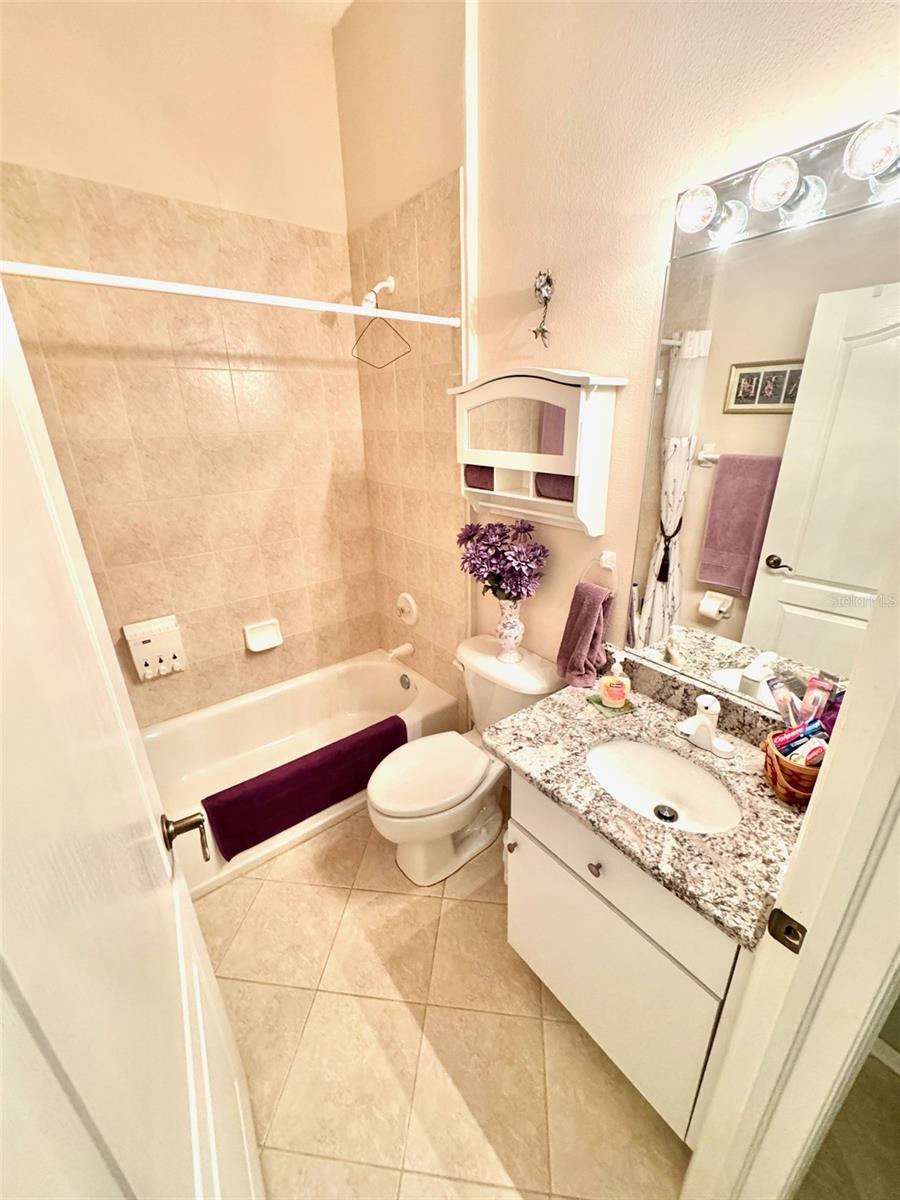 Guest bathroom with granite counter