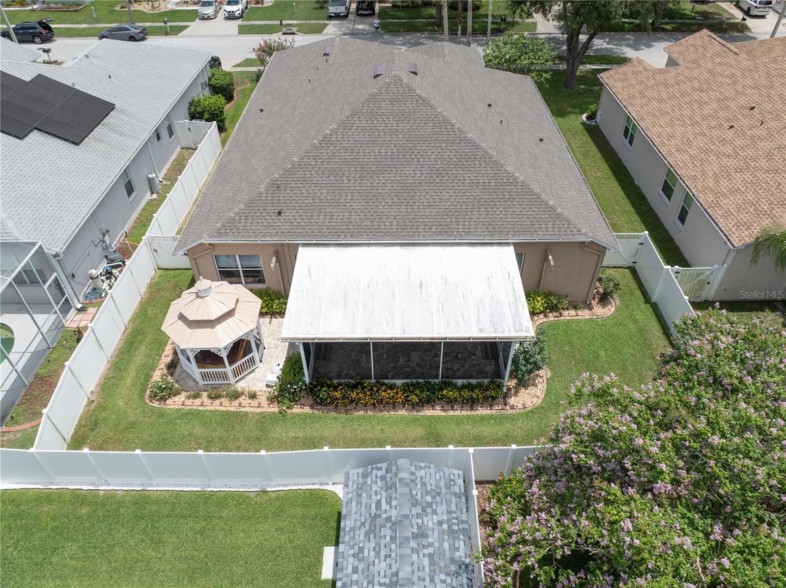 Aerial view of backyard, gazebo, and screened lanai