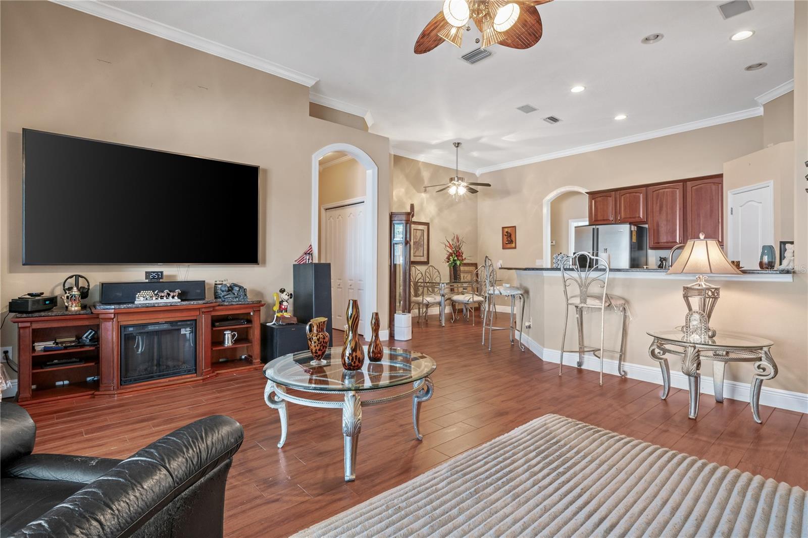 Living room with view of kitchen area