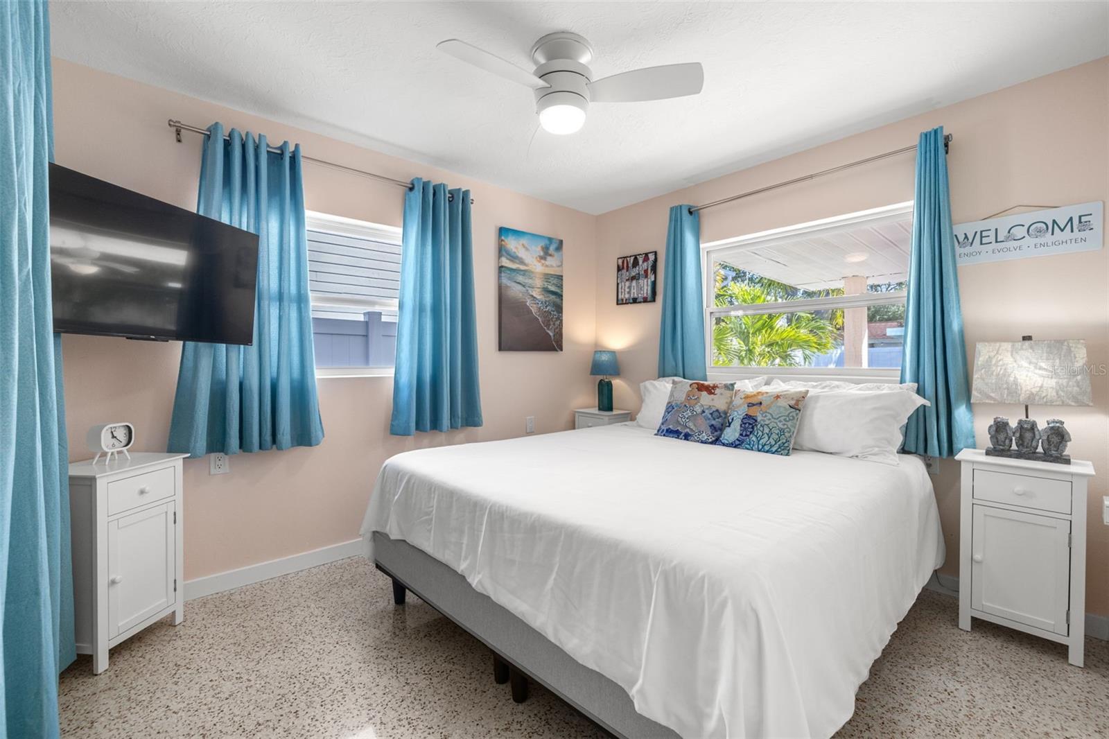 Split plan for bedrooms - this one with bath on this side of the house and then on the other is a large primary with slider to pool and a bunk bed room ready for you and your friends or guests