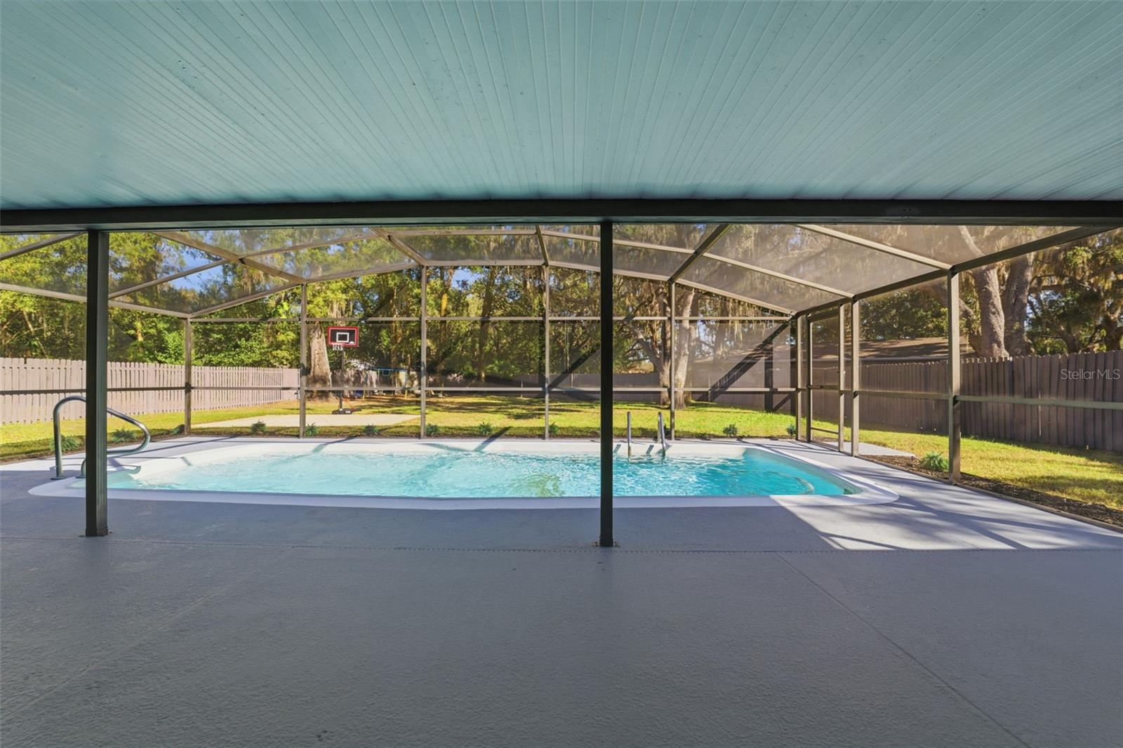 screened in pool and deck