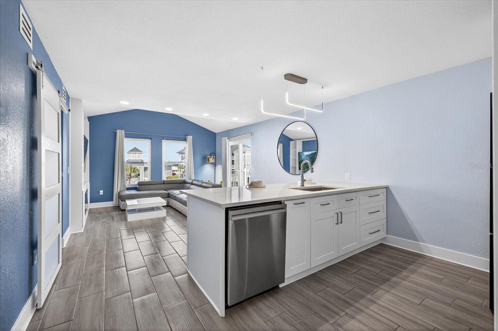 Kitchen that opens to living room