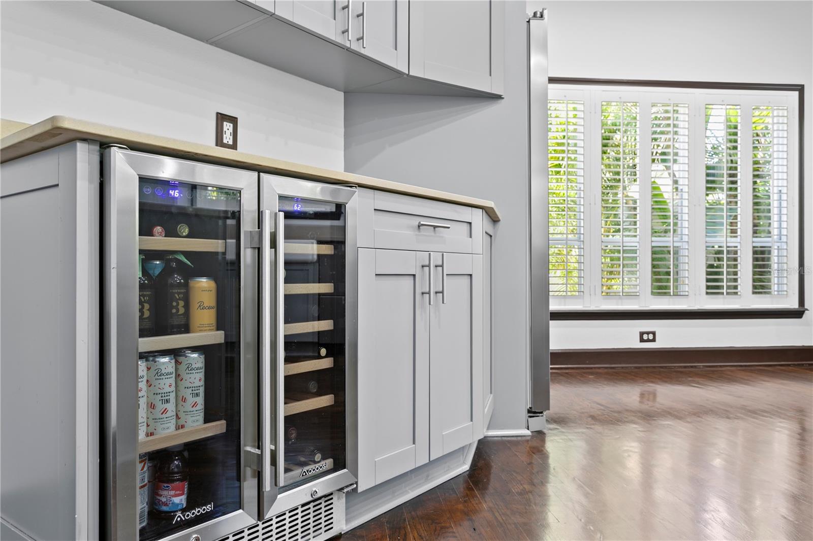 This stainless, elegant wine refrigerator adds modern convenience and style to the updated kitchen.