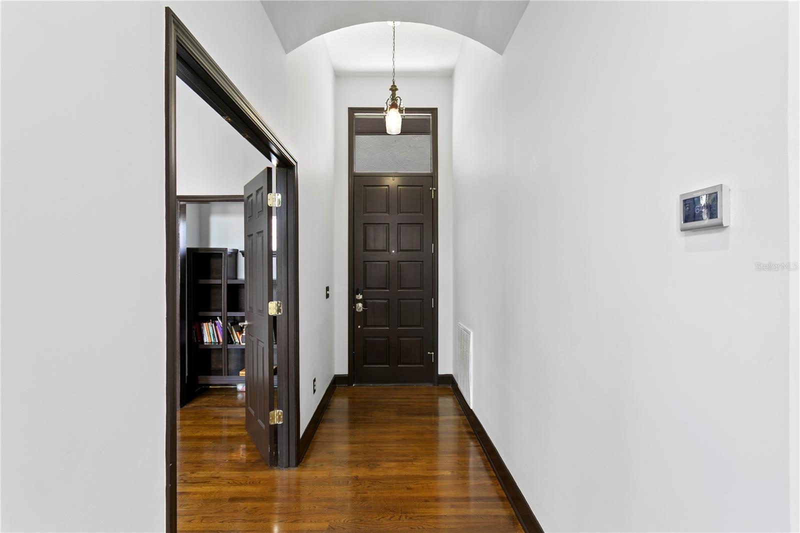 Inside, 9-foot ceilings and graceful crown molding create an airy, elegant ambiance.