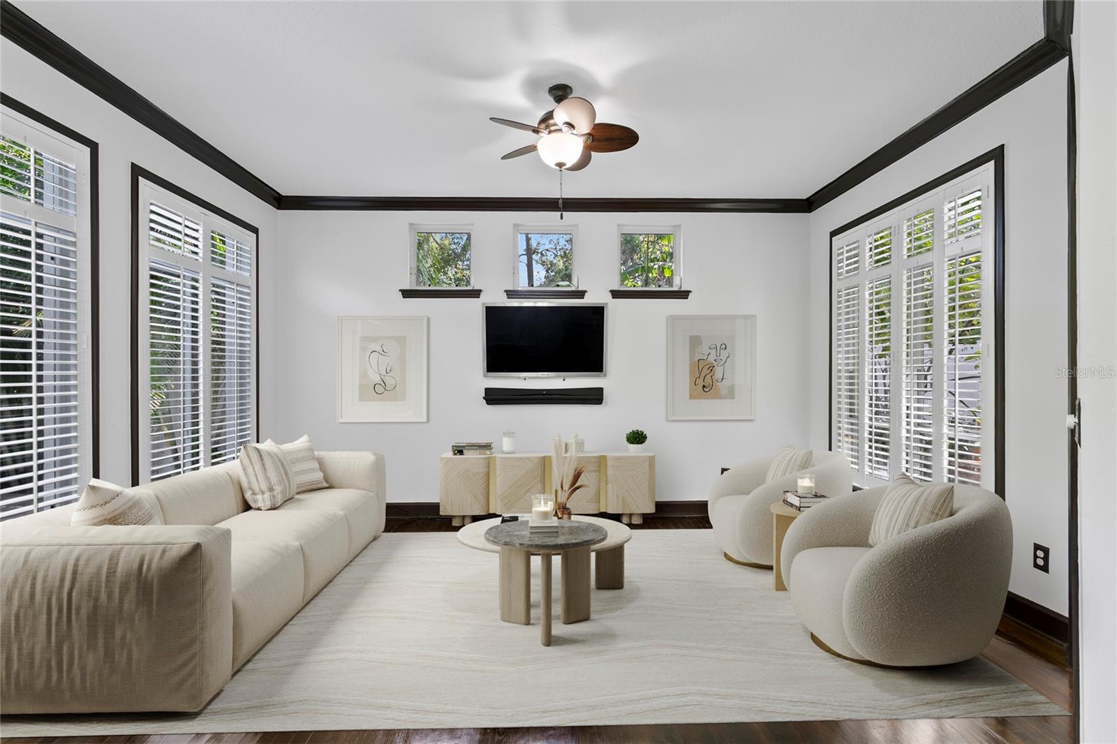 The spacious family room filled with abundant natural light, seamlessly opens to the kitchen—perfect for entertaining and everyday living.