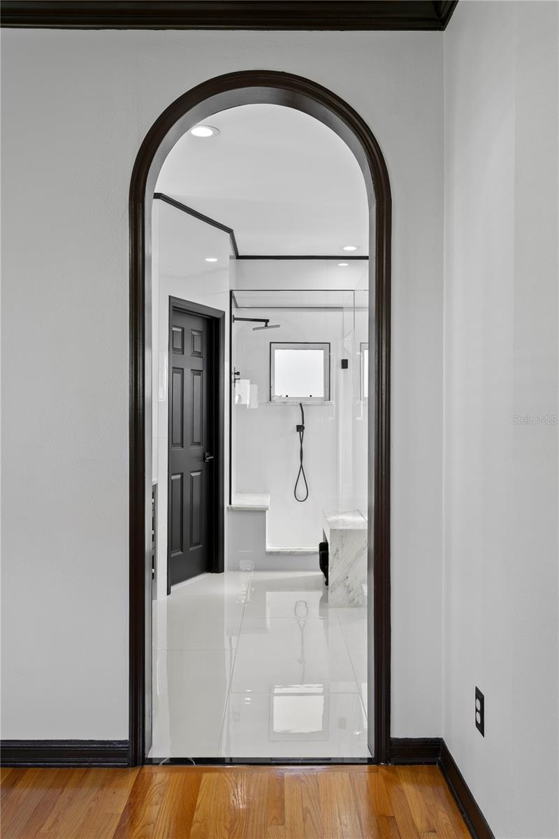 This elegant doorway leads to the incredible spa-like bathroom.
