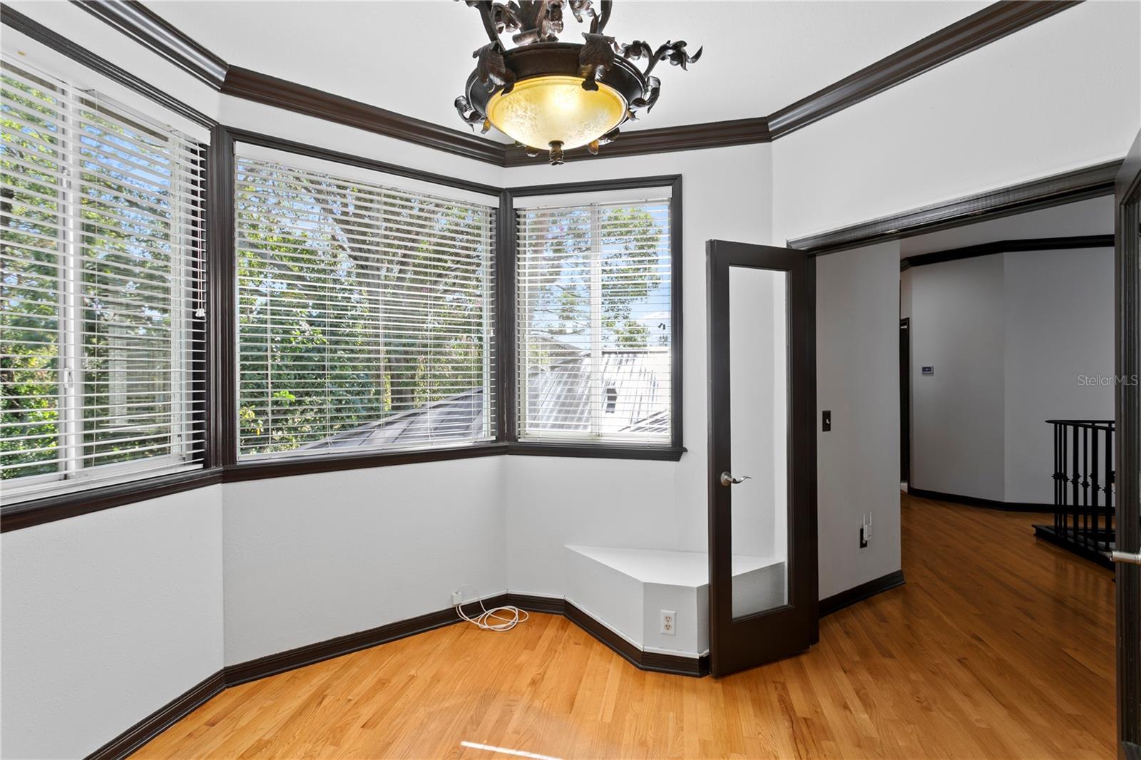 This bonus room is a tranquil space nestled in the treetops—perfect for a nursery, home office, or gym.