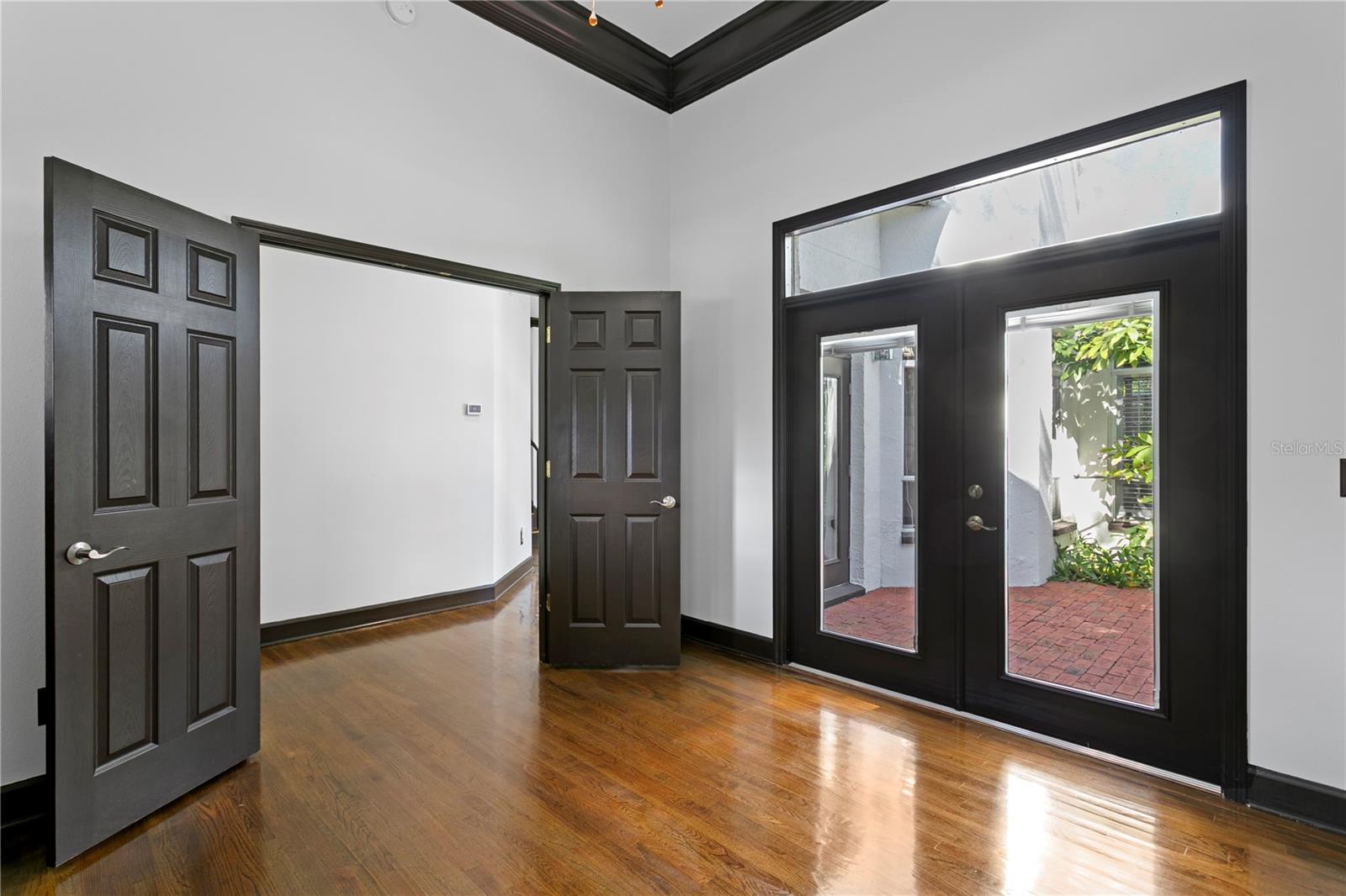 Light and airy with elegant double doors and direct access to the peaceful courtyard.