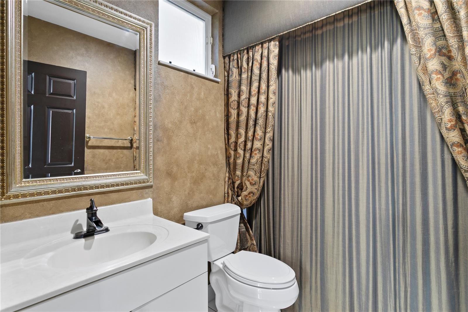 En-suite bath off the downstairs guest room.