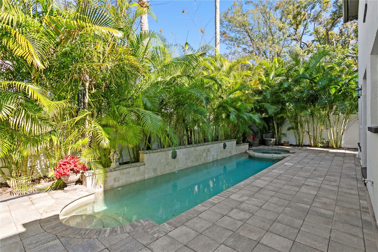 The backyard oasis boasts a secluded heated salt water pool and spa (2015).