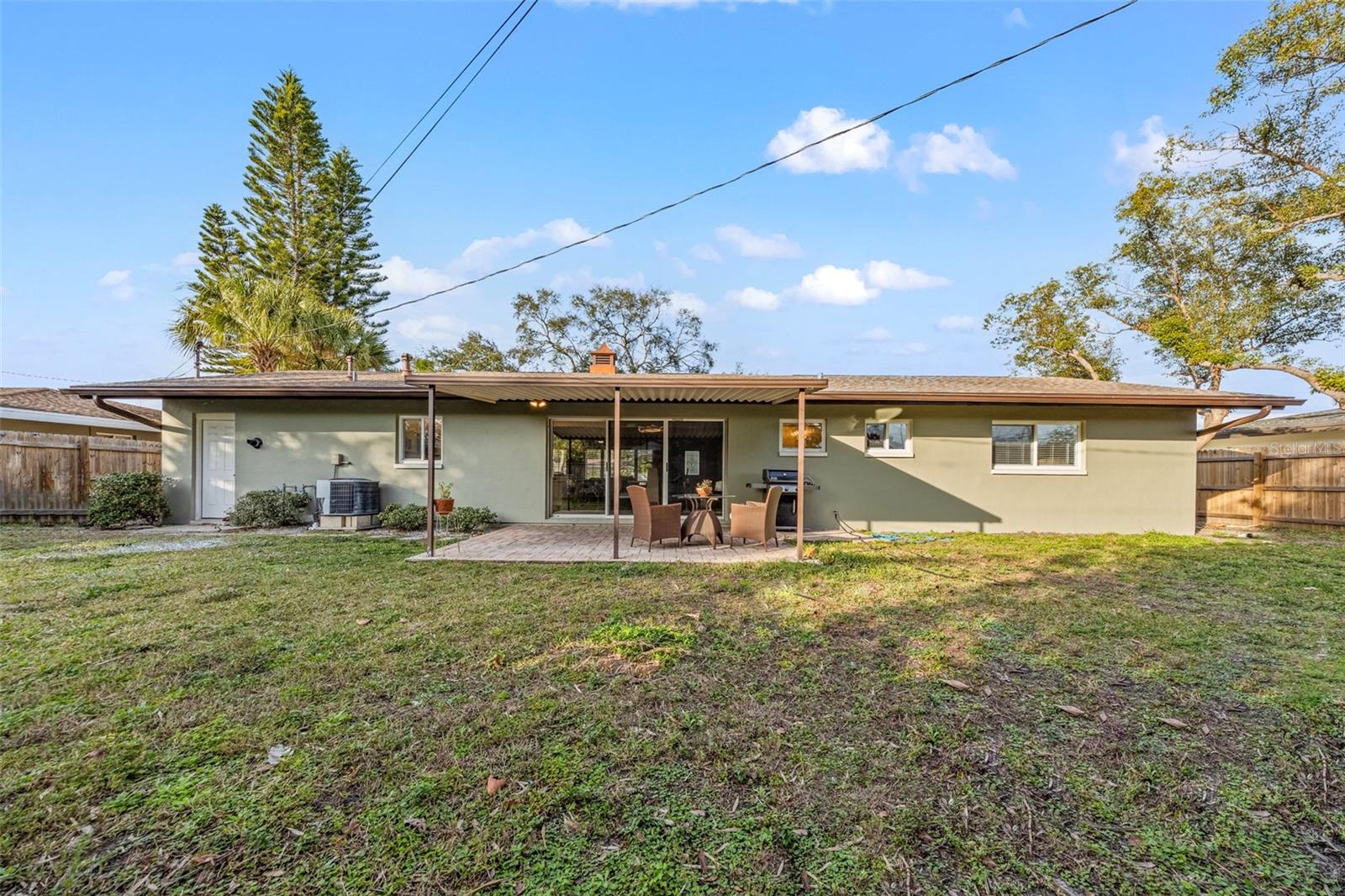 View of rear of home from fence