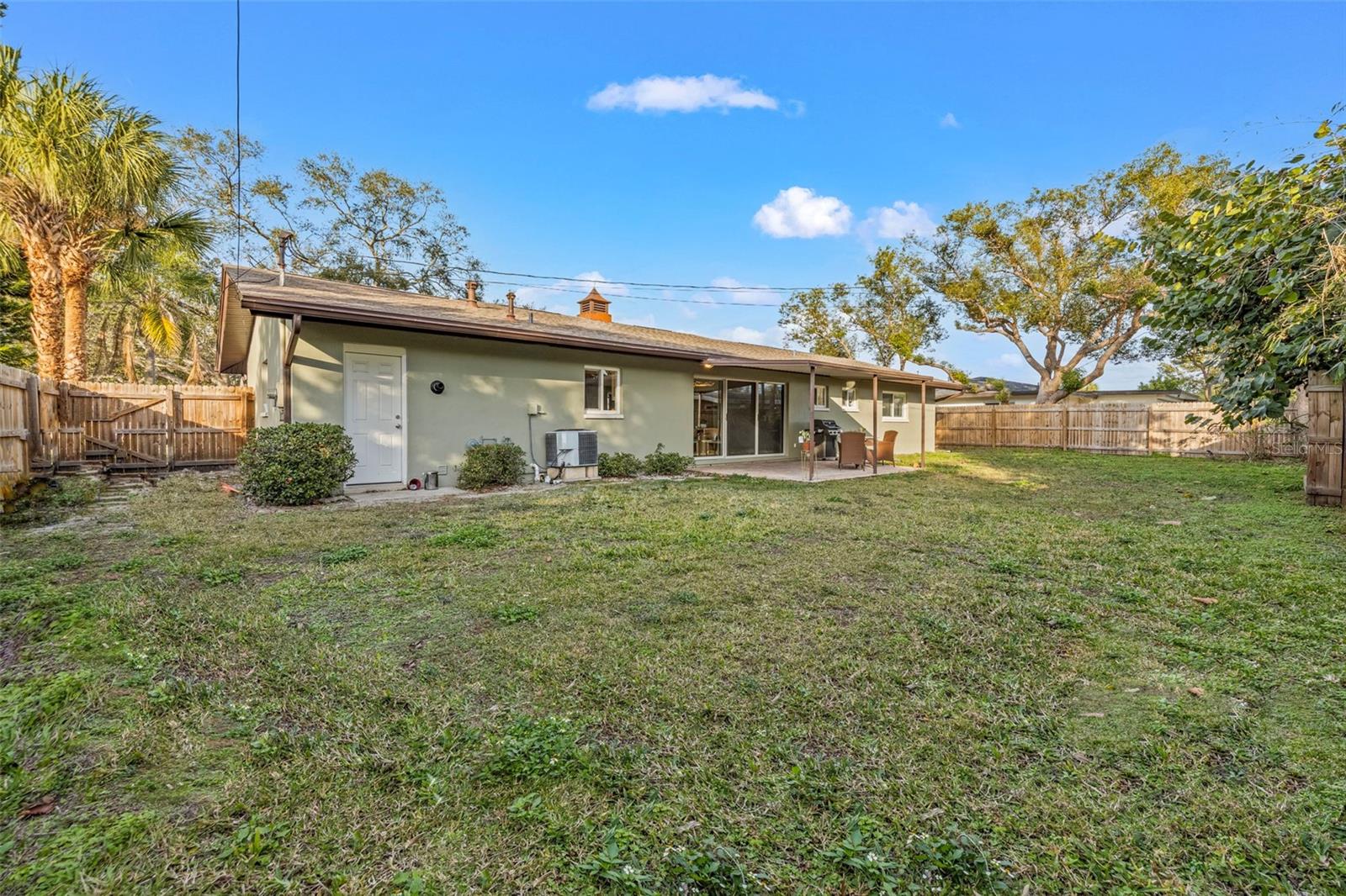 View of rear of home from fence