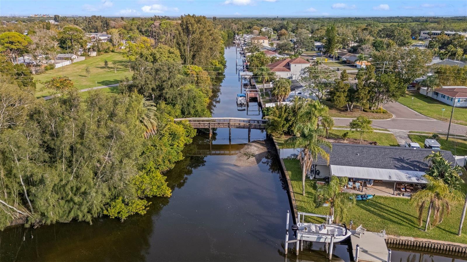 Aerial view from the West of the bridge walkway to park and trail on the left