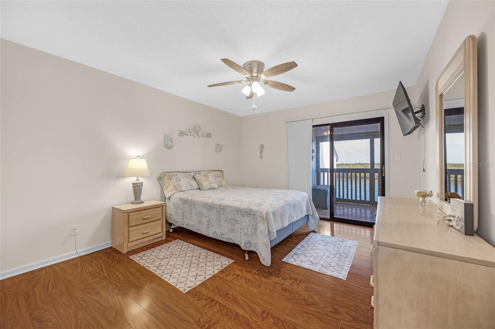 Primary Bedroom with Sliding Glass Doors out to Balcony