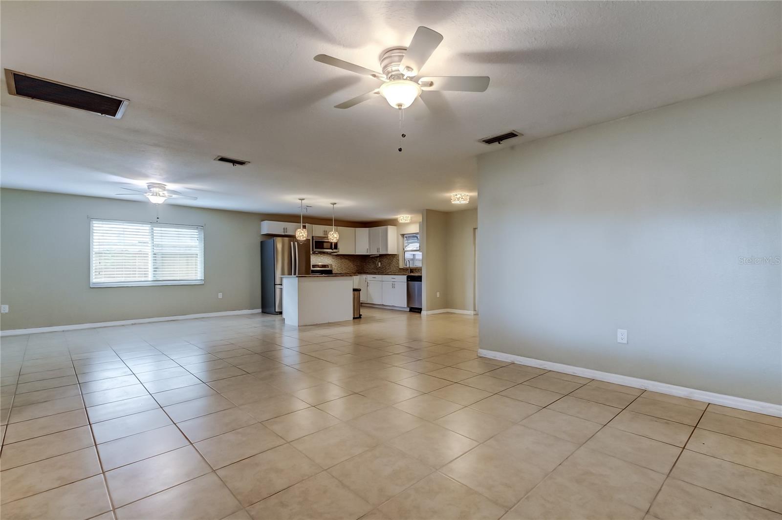 Living room looking towards family room, kitchen and dining room.
