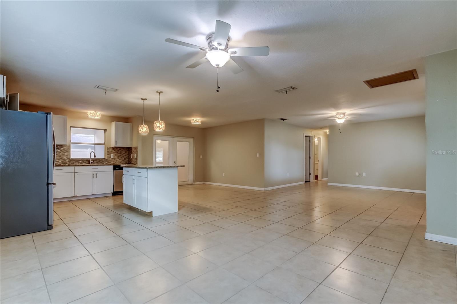 Family room looking towards kitchen, dining and living room.