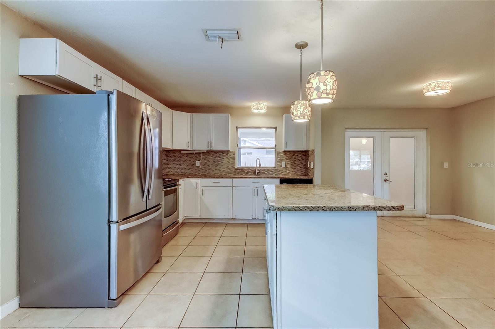Kitchen. Island and counter tops are granite.