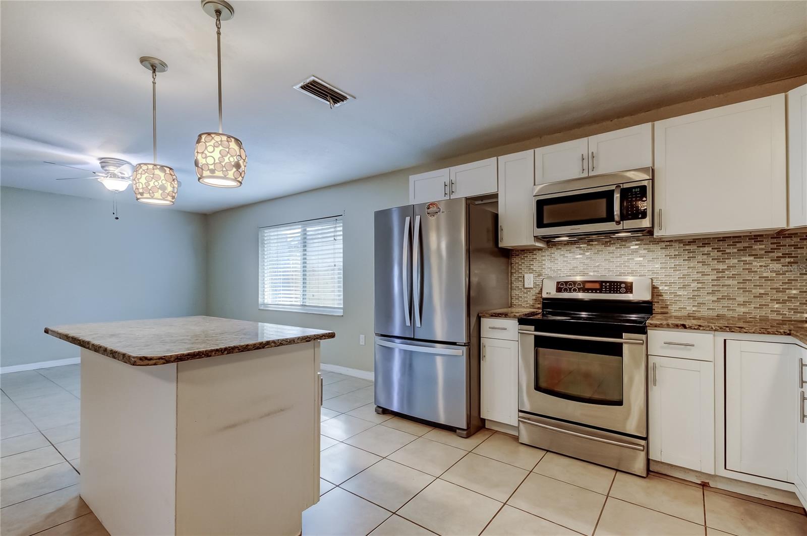 Another view of kitchen looking towards family room.