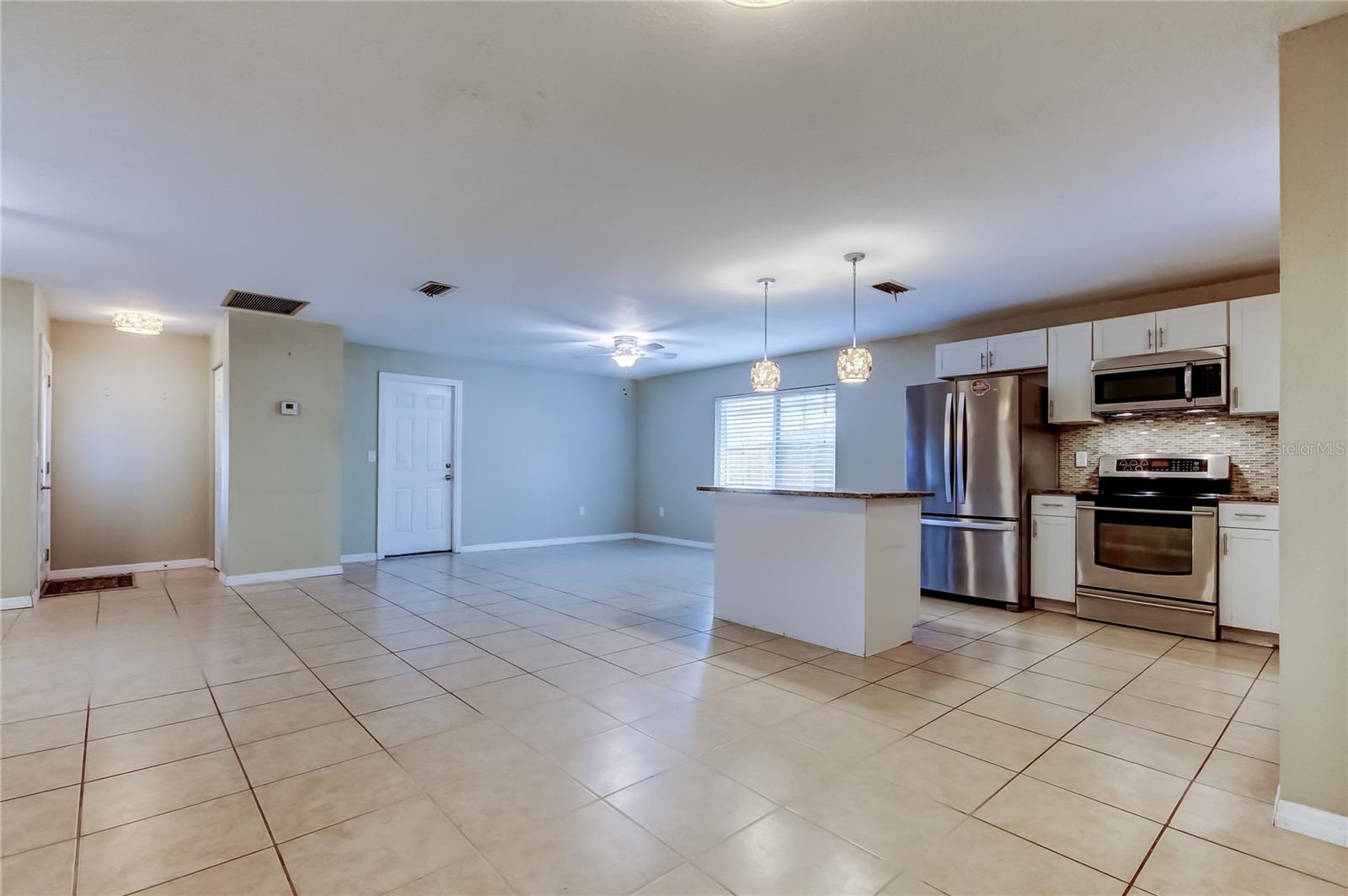 Dining room looking towards kitchen, family room and front foyer.