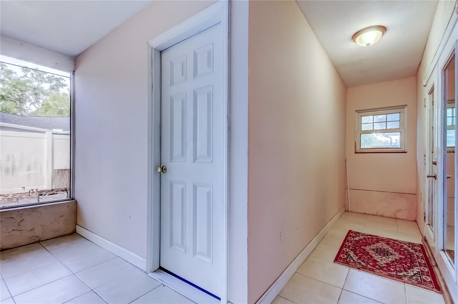 Hallway area, off dining room. Door leads to a bonus room.