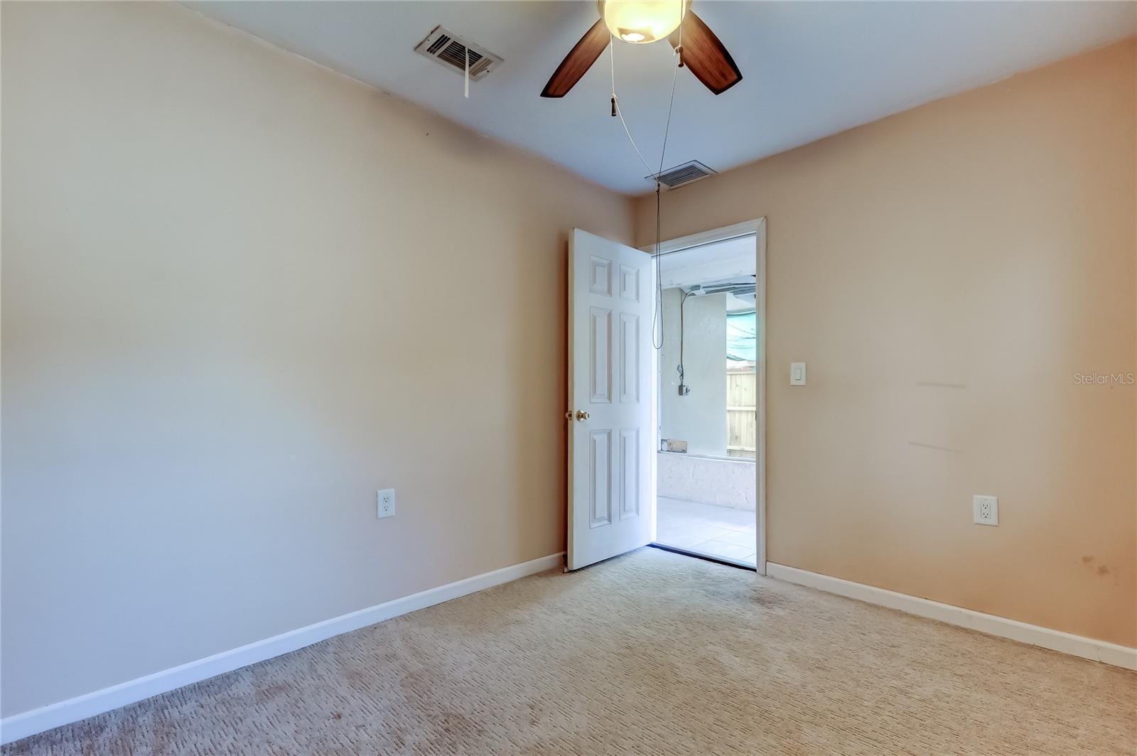 Bonus room looking towards screen enclosed patio.