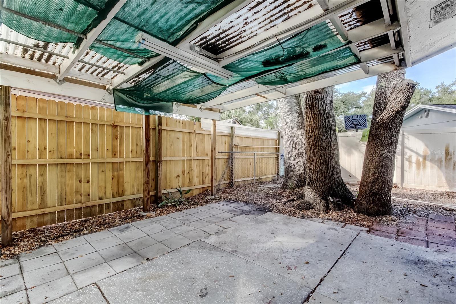 SW side of house with covered, open patio.