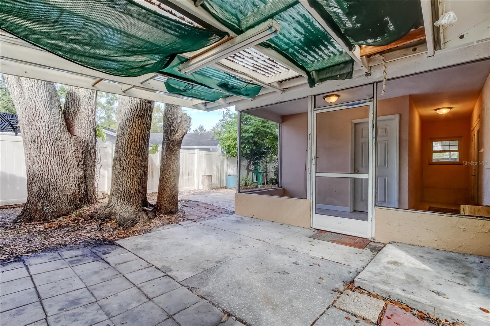 Exterior side yard looking towards screen covered patio.