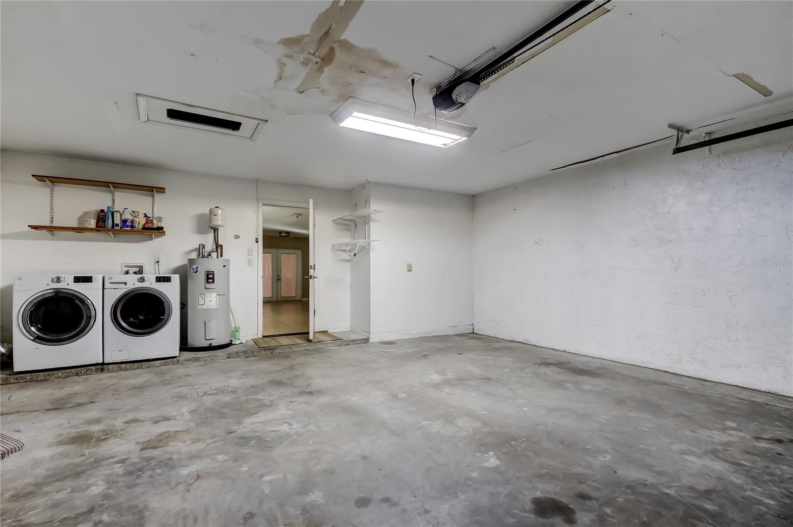 Garage with washer and dryer.