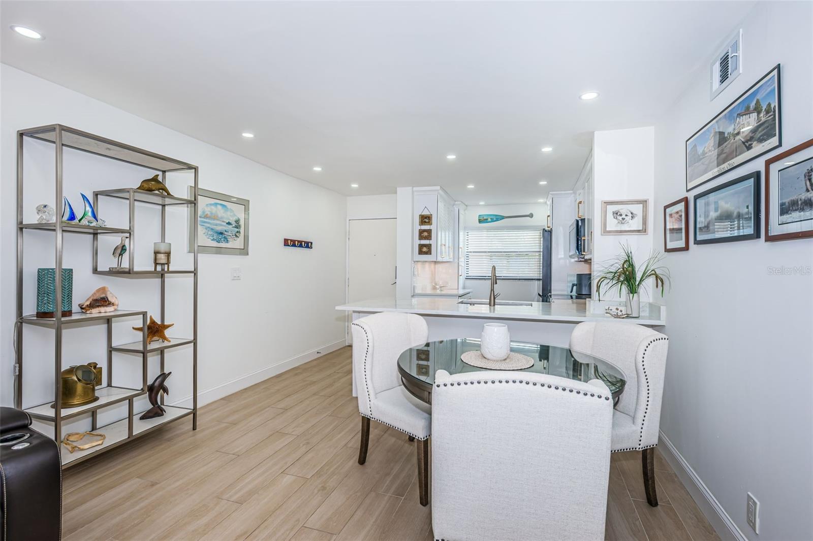 Dining area - notice the abundance of recessed lighting throughout the condo